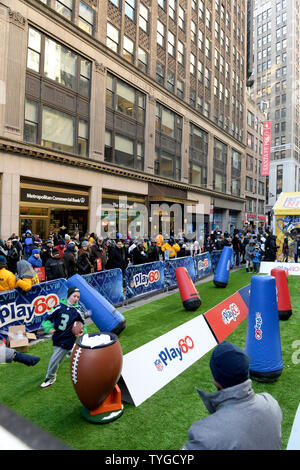 Fans get a chance on the Super Bowl toboggan run near Times Square at the  NFL Super Bowl Boulevard Fan Experience that takes up 13 blocks of Broadway  in downtown Manhattan, New