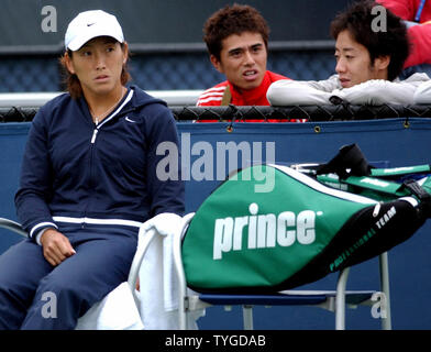 NYP2003090305 - NEW YORK, SEPT. 3 (UPI)  Ai Sugiyama (Japan) sits thru  a 3rd rain delay in her match against Francesca Schiavone (France) on Sept. 3, 2003 at the 2003 US Open in Flushing Meadow, New York.  ep/Ezio Petersen   UPI Stock Photo