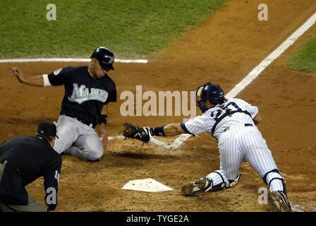 New York Yankees catcher Jorge Posada tags out Florida Marlins