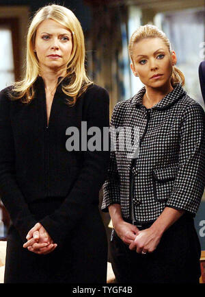 Actresses Faith Ford and Kelly Ripa (right) listen to New York City's Mayor Michael Bloomberg on Dec. 4, 2003 as he visits the Silvercup Studios set for the tv sitcom 'Hope & Faith.'    (UPI Photos/Ezio Petersen) Stock Photo