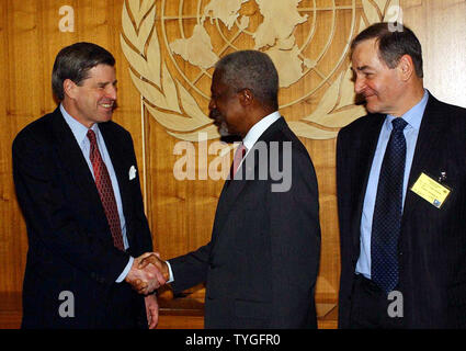 United Nations Secretary General Kofi Annan (center) greets U.S. Administrator for Iraq Paul Bremer while United Kingdom Ambassador Jeremy Greenstock looks on before Jan. 19, 2004 meetings in New York on Iraq.  (UPI/Ezio Petersen) Stock Photo