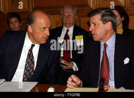 U.S. Ambassador to the UN John Negroponte (left) chats with  U.S. Administrator for Iraq Paul Bremer before the  Jan. 19, 2004 meetings in New York on Iraq.  (UPI/Ezio Petersen) Stock Photo