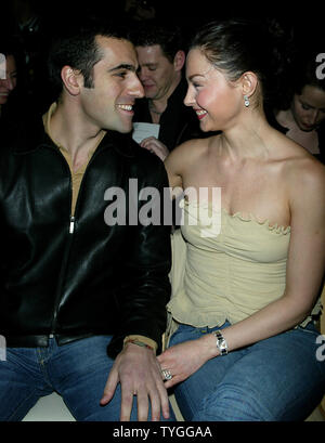 Ashley Judd and husband pose for pictures at the Tuleh Fall 2004 Fashion Shows at Bryant Park in New York on February 8, 2004.   (UPI Photo/Laura Cavanaugh) Stock Photo