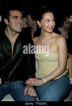 Ashley Judd and husband pose for pictures at the Tuleh Fall 2004 Fashion Shows at Bryant Park in New York on February 8, 2004.   (UPI Photo/Laura Cavanaugh) Stock Photo