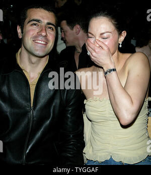 Ashley Judd and husband pose for pictures at the Tuleh Fall 2004 Fashion Shows at Bryant Park in New York on February 8, 2004.   (UPI Photo/Laura Cavanaugh) Stock Photo