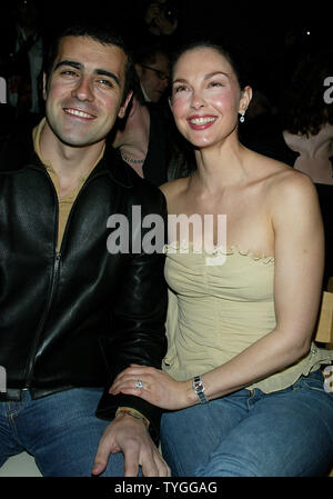 Ashley Judd and husband pose for pictures at the Tuleh Fall 2004 Fashion Shows at Bryant Park in New York on February 8, 2004.   (UPI Photo/Laura Cavanaugh) Stock Photo