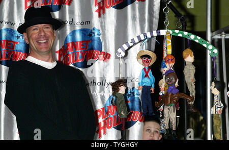 Bruce Willis donates memorabilia from his new movie 'The Whole Ten Yards' to Planet Hollywood Times Square in New York on April 5, 2004.   (UPI Photo/Laura Cavanaugh) Stock Photo