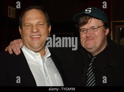 Producer Harvey Weinstein (left) poses with Academy Award winning director/documentarian Michael Moore on June 14, 2004 at the premeire of their new controversal film on President Bush entitled ' Fahrenheit 9/11' (UPI Photo/Ezio Petersen) Stock Photo