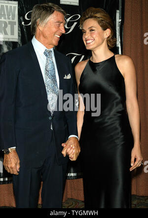 Mariska Hargitay and father Mickey Hargitay pose for pictures at the American Women in Radio & Television Annual Gracie Allen Awards Gala at the Hilton Hotel in New York on June 22, 2004.   (UPI Photo/Laura Cavanaugh) Stock Photo