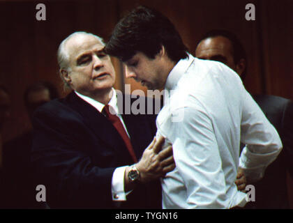 Marlon Brando is shown with son Christian after bail conditions were set for Christian 1990 murder trial of his half sister Cheyenne abusive boyfriend. Marlon who won Best Actor Oscar Awards for his performances in the films 'On the Waterfront' and 'The Godfather' died at the age of 80 on July 1, 2004 in Los Angeles. (UPI Photo/L.Davis) Stock Photo