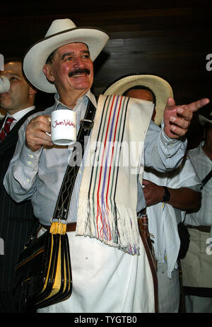 Juan Valdez, the icon of Colombian coffee, poses for pictures at the opening of the Juan Valdez Cafe in New York in New York on September 28, 2004.  (UPI Photo/Laura Cavanaugh) Stock Photo