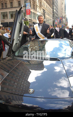 Reknown race car driver Mario Andretti serving as Grand Marshall waits to lead the 60th annual Columbus Day Parade up New York City's 5th Avenue on Oct. 11, 2004 in his Lamborgdini race car. (UPI Photo/Ezio Petersen) Stock Photo