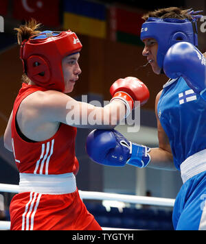 Ireland's Grainne Walsh (left) on her way to winning her Women's Welterweight Boxing Quarter Final against Finland's Elina Gustafsson, during day six of the European Games 2019 in Minsk. Stock Photo