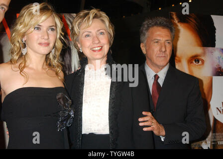 Actress Kate Winslet poses with New York Senator Hillary Rodham Clinton (center) and actor Dustin Hoffman (who stars in the film) at the Oct. 25, 2004 New York premiere for Winslet new film 'Finding Neverland' which was held at the Brooklyn Museum in New York.  (UPI Photo/D.Van) Stock Photo