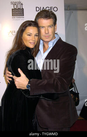 Keely Shay Smith and husband Pierce Brosnan pose  for photographers at the New York premiere of ' After The Sunset' on November 9, 2004 at the Ziegfeld Theatre in New York City.   (UPI Photo/Robin Platzer) Stock Photo