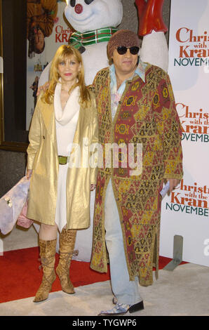 Maureen and Steven Van Zandt pose for photographers at the World Premiere of ' Christmas with the Kranks' on November 15, 2004 at Radio City Music Hall in New York City.  (UPI Photo/Robin Platzer) Stock Photo