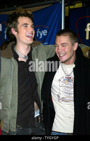 'One Tree Hill' castmembers Tyler Hilton (left) and Chad Michael Murray sign copies of the shows soundtrack CD at FYE in New York on January 25, 2005.  (UPI Photo/Laura Cavanaugh) Stock Photo