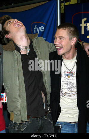 'One Tree Hill' castmembers Tyler Hilton (left) and Chad Michael Murray sign copies of the shows soundtrack CD at FYE in New York on January 25, 2005.  (UPI Photo/Laura Cavanaugh) Stock Photo