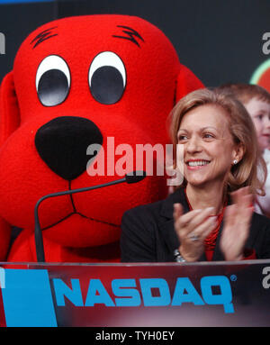 Deborah Forte, President of Scholastic Entertainment is joined by their  most famous book characther Clifford The Big Red Dog and Bob Greifeld, CEO  of NASDAQ at the 2/14/05 ceremonial NASDAQ opening bell