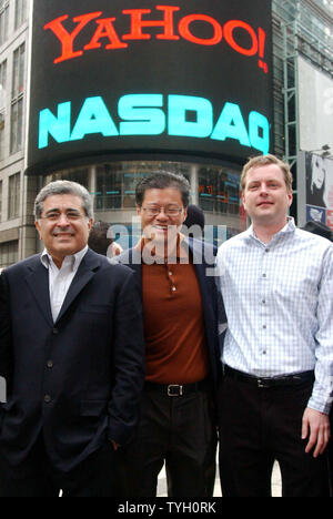 Terry Semel, Chairman and CEO of Yahoo, Jerry Yang, Chief Yahoo and co-founder and David Filo, Chief Yahoo and co-founder (left to right) pose on 3/2/05 outside of the NASDAQ in New York's Times Square district to celebrate the 10th annniversary of Yahoo.   (UPI Photo/Ezio Petersen) Stock Photo