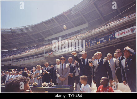 President attends the 32nd All-Star Baseball Game, throws out first ball. Speaker of the House John W. McCormack, Dave Powers, Vice President Johnson, President Kennedy, Commisioner of Baseball Ford. C. Frick, Lawrence O'Brien, others ( in foreground- Dennis Marcel, Frank Brown, members of the Washington Boys Club ). Washington, D.C., D.C. Stadium Stock Photo