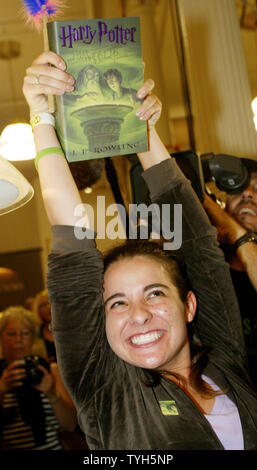 Rachael Grandi reacts as she is the first customer at the Barnes and Noble bookstore to purchase the new 'Harry Potter and the Half-Blood Prince'  which was released at midnight on July 15, 2005 in New York City. Thousands of bookstores nationwide stayed open late for the anticipated midnight release of the sixth Harry Potter book of which 10.8 million copies have already been printed. (UPI Photo/Monika Graff) Stock Photo