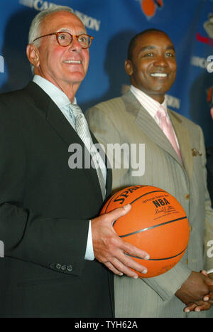 Basketball Hall of Famer Larry Brown, left, stands by New York Knick's president Isiah Thomas after the Knicks accounce that Brown is their new head coach during a press conference at Madison Square Garden on July 28, 2005 in New York City. Brown, former coach for the Detroit Pistons, will be the highest paid basketball coach ever, receiving over $10 million a year.  (UPI Photo/Monika Graff) Stock Photo