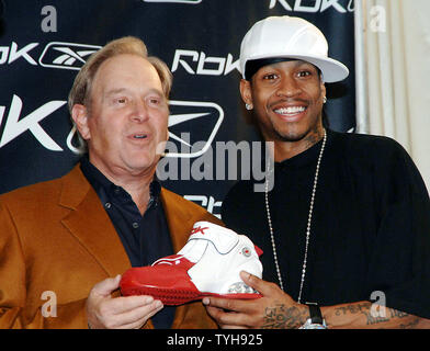 Philadelphia 76ers basketball star Allen Iverson and Paul Fireman, Reebok Chairman and CEO (left) meet the New York media on Oct. 17, 2005 to discuss Iverson 10th anniversary of footwear collection for Reebok and to introduce his new basketball shoe Answer IX.  (UPI Photo/Ezio Petersen) Stock Photo