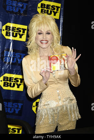 Singer Dolly Parton arrives to sign copies of her new CD 