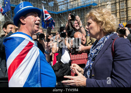London, UK. 26 June, 2019. Anna Soubry, Change UK MP for Broxtowe, wishes noted anti-Brexit campaigner Steve Bray of SODEM (Stand of Defiance European Movement) a happy 50th birthday outside Parliament. Credit: Mark Kerrison/Alamy Live News Stock Photo