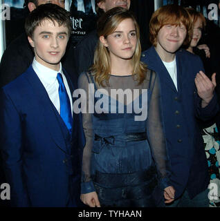 Actors Daniel Radcliffe (Harry Potter), Emma Watson and Rupert Grint (left to right) pose at the November 12, 2005 U.S. premiere screening for their new film Harry Potter and the Goblet of Fire.  (UPI Photo/Ezio Petersen) Stock Photo