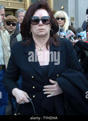 Victoria Gotti, mother, leads her daughter Victoria thru the media outside Manhattan Federal Court on March 10, 2006 after hearing  jurors declare a mistrial during the 3rd day of jury deliberations for her son John Gotti Jr. 2nd retrial on racketeering and kidnapping charges. The U.S. Attorney announced that they will retry Gotti for a 3rd time.  (UPI Photo/Ezio Petersen) Stock Photo