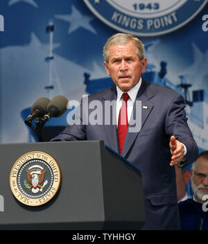 President George W. Bush raises his hand while he speaks during graduation day at the United States Merchant Marine Academy in Kings Point, NY on June 19, 2006.  (UPI Photo/John Angelillo) Stock Photo