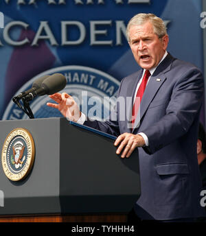 President George W. Bush raises his hand while he speaks during graduation day at the United States Merchant Marine Academy in Kings Point, NY on June 19, 2006.  (UPI Photo/John Angelillo) Stock Photo