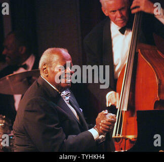 Legendary Jazz pianist Oscar Peterson performs in New York at the Birdland Jazz club with David Young (bass) on August 22, 2006. (UPI Photo/Ezio Petersen) Stock Photo