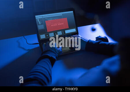 hands of hacker with access denied message laptop Stock Photo