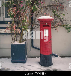 Postbox in snow, Whitby, North Yorkshire, UK. Stock Photo