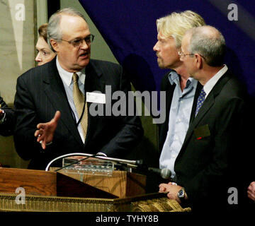 Marsh Carter, left, chairman of the New York Stock Exchange, talks with Sir Richard Branson, founder of Virgin and ambassador to ORBIS, and James Parker, right, senior vice president of Air Operations at FedEx, after the opening bell ceremony at the New York Stock Exchange as they celebrate the 25th anniversary of ORBIS International at the exchange on March 2, 2007 in New York City. ORBIS International, which is sponsored by FedEx, provides eye care to 85 countries including Ethiopia where last year 425,000 people were treated.   (UPI Photo/Monika Graff) Stock Photo