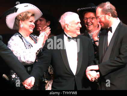 Actress Debra Monk applaudes the shows creator composer John Kander and Rupert Holmes(book and additional lyrics) (left to right) during  their  opening night curtain call bows in the Broadway musical 'Curtains' which opened on March 22, 2007 at the Al Hirschfeld theatre in New York. Kander longtime partner lyrcist Fred Ebb died during the writing of the show.    (UPI Photo/Ezio Petersen) Stock Photo