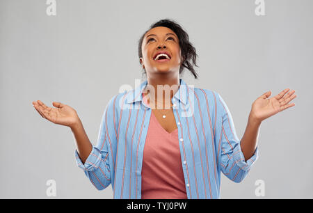 grateful african american woman looking up Stock Photo