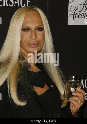 Donatella Versace holds up her new fragrance, Versace, at Saks Fifth Avenue  in New York City on May 8, 2007. (UPI Photo/John Angelillo Stock Photo -  Alamy