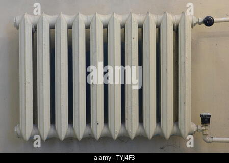Cast iron radiator on the wall Stock Photo