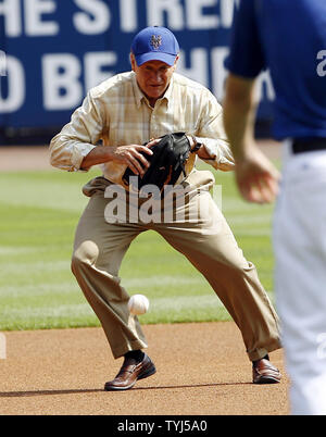 Robin Williams fields a ball while filming the movie 'Old Dogs' with John Travolta at Shea Stadium in New York City on July 26, 2007.  (UPI Photo/John Angelillo) Stock Photo