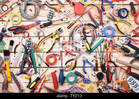 Electricians tools on wooden table directly above Stock Photo