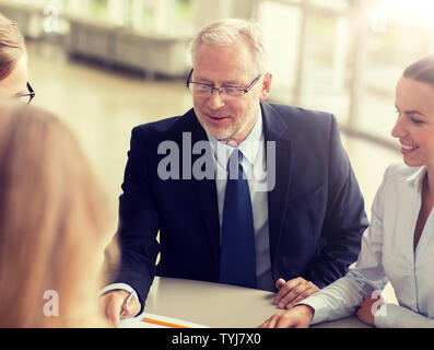 smiling business people meeting in office Stock Photo