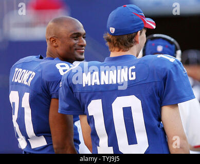 New York Giants guard Shaun O'Hara celebrates as wide receiver Amani Toomer  scores the winning touchdown. the New York Giants defeated the Denver  Broncos 24-23 in week 7 at Giants Stadium in