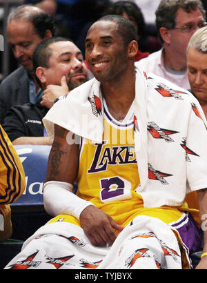 Los Angeles Lakers Kobe Bryant (24) smiles on the bench against 