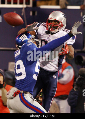 Washington Redskins Rock Cartwright (31) is tackled by New York Giants  Gerris Wilkinson (59) during their game played at FedEx Field in Landover,  Maryland, Sunday, November 30, 2008. (Photo by Harry E.