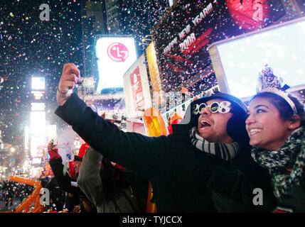 Confetti rains down on Times Square at the stroke of midnight during the New Year&#039;s Eve