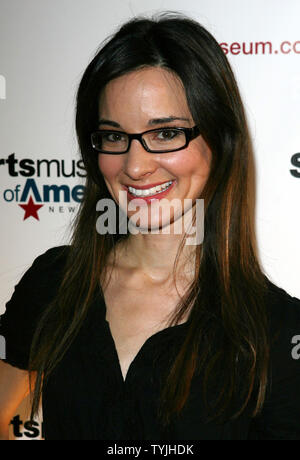 Alison Becker arrives on the red carpet at the Sports Museum of America